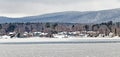 Frozen Pontoosuc Lake and snow covered Berkshires