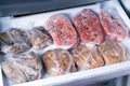 Frozen pork neck chops meat steakin the freezer. Frozen food Royalty Free Stock Photo