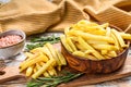 Frozen potatoes in a bowl, French fries, canned food. White background. Top view