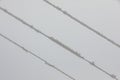 Frozen power line pylons. Hoarfrost on high voltage cables and pylons. Winter in the mountains Royalty Free Stock Photo