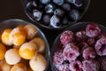 Frozen raspberries, currants and cherry plums Royalty Free Stock Photo
