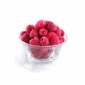 Frozen raspberries in a glass bowl isolated on white background Royalty Free Stock Photo