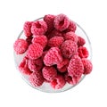 Frozen raspberries in a glass bowl - top view - isolated on white Royalty Free Stock Photo