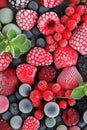 Frozen raspberries, strawberry and blueberries with ice crystals Royalty Free Stock Photo