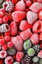 Frozen raspberries, strawberry and blueberries with ice crystals Royalty Free Stock Photo