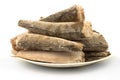 Frozen raw fish hake, pollock on the plate isolated on white background Royalty Free Stock Photo