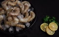 Frozen raw shrimp vannamey, on wooden skewers, ice cubes and lime slices, top view, no people, Royalty Free Stock Photo