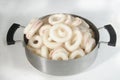 Frozen raw squid rings in aluminum tray Royalty Free Stock Photo