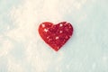 frozen red heart on snow