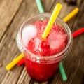 Frozen Red Slushie in Plastic Cup with Straw Royalty Free Stock Photo