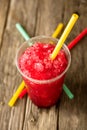 Frozen Red Slushie in Plastic Cup with Straw Royalty Free Stock Photo