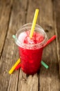 Frozen Red Slushie in Plastic Cup with Straw Royalty Free Stock Photo