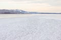 Frozen River and distant mountains Royalty Free Stock Photo