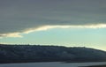 Frozen River and distant mountains Royalty Free Stock Photo