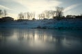 Frozen river shore small town