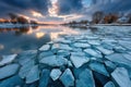 Frozen River at Sunset with Broken Ice Sheets Royalty Free Stock Photo