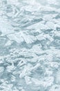 Frozen river surface. Melting rippled ice block with cracks Royalty Free Stock Photo