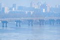 Frozen river. Two parallel bridges. Kiev. Ukraine. Winter snowy river scenery from Kiev. Ukraine.