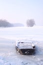 A small boat trapped in the frozen Danube river Royalty Free Stock Photo