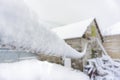 The frozen rope hangs on the street and is all covered with snow