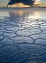 Frozen sea ice with pollution in background