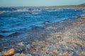 Frozen sea side beach panorama in winter with lots of ice and snow in late evening Royalty Free Stock Photo