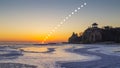 Frozen seashore and partial solar eclipse