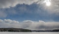 Beautiful blue sky between thick snow clouds in Haliburton Ontario