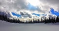 Frozen Snow Covered Lake with Sunrise