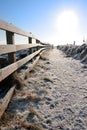 Frozen snow covered path on cliff fenced walk