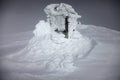 Frozen snow covering an old meteo station in Svalbard