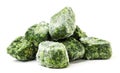 Frozen spinach cubes close-up on a white background. Isolated Royalty Free Stock Photo