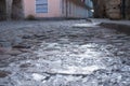 Frozen stone road with ice in old town of Tallinn Estonia. Royalty Free Stock Photo