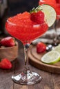 Frozen strawberry daiquiri cocktail with strawberries and lime Royalty Free Stock Photo