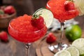 Frozen strawberry daiquiri cocktail with strawberries and lime Royalty Free Stock Photo
