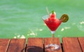 Frozen Strawberry Daiquiri cocktail on the wooden pier. Concept Royalty Free Stock Photo