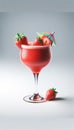 Frozen strawberry daiquiri drink in a poco grande glassware with strawberry on the rim