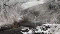 Frozen stream with waterfall and icicles in the winter, Ukraine