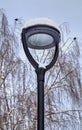 Frozen street light with icicles in cold winter day Royalty Free Stock Photo