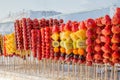 Frozen sugar coated fruits on sticks Royalty Free Stock Photo