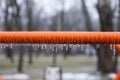 Frozen swing with icicles, playground, horizontal bars Royalty Free Stock Photo