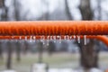 Frozen swing with icicles, playground, horizontal bars Royalty Free Stock Photo