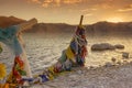 Frozen Tibetan colorful Prayer flags in the golden sunrise on the banks for Pangong Tso Lake in Northern India