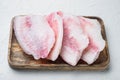 Frozen tilapia fish meat, on white background
