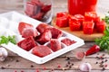 Frozen tomato paste in the plastic shape on wooden background. Life hacks, simple way to store vegetables