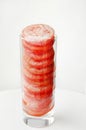 Frozen tomato rings in a glass close-up. Frozen tomatoes. Soft focus. Concept of healthy eating