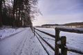 Frozen trail and leaves on a field