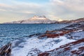 Frozen tundra landscape with cold greenlandic sea and snow Sermitsiaq mountain in the background, nearby Nuuk city Royalty Free Stock Photo