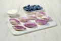 Frozen vareniki with blueberry and sour cream