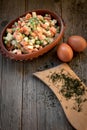 Frozen vegetables in a bowl on a wooden table Royalty Free Stock Photo